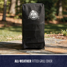 Black, all-weather fitted grill cover with Pit Boss logo, designed for outdoor protection. Stands upright on patio.