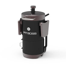 Black Pit Boss portable charcoal grill with folding side tables.