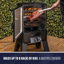 Vertical black smoker with open door, showing racks of ribs, chicken, and veggies inside. Holds up to 8 racks of ribs.