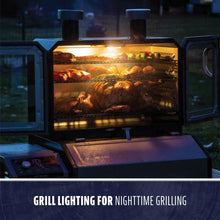 Outdoor grill with built-in interior lighting, showing food cooking on multiple racks for easy nighttime grilling.