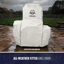 White, all-weather fitted grill cover with "Pit Boss Lockhart" logo, shown protecting a grill in the rain.