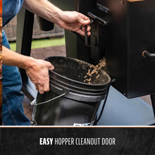 Black pellet grill with easy hopper cleanout door.