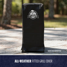 Black all-weather fitted grill cover with Pit Boss logo, designed for outdoor protection. Stands upright on patio.