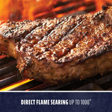 Juicy steak sizzling on a grill with direct flame searing, reaching temperatures up to 1000°F.