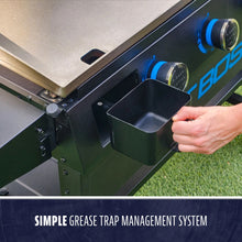 Black grease trap management system with hand holding a drip tray.