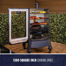 Gray electric smoker with 1300-square-inch cooking space, open door revealing food.