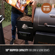 Black Pit Boss pellet grill with 18lb hopper capacity for low & slow cooking.