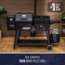 Black Pit Boss DX Series 1020 Wood Pellet Grill on wheels.