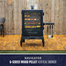Pit Boss Navigator 6-Series wood pellet vertical smoker with glass door, black finish, and side tool rack.