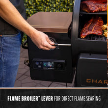 Black Pit Boss grill with Flame Broiler lever for direct flame searing.