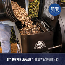 Black Pit Boss smoker with 21lb hopper capacity for low and slow cooking.