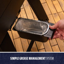 Rectangular grease tray with foil liner, easy to slide out for cleaning. Labeled "Simple Grease Management System."