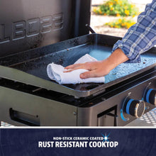 Non-stick ceramic coated, rust-resistant cooktop with easy-clean surface and blue control knobs.