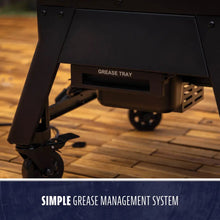 Black grill base with labeled grease tray and wheels, featuring a simple grease management system for easy cleaning.