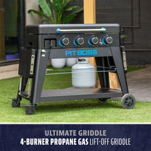 Pit Boss 4-burner propane gas griddle with lift-off top, black frame, blue accents, and wheeled base for easy mobility.