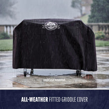 Black Pit Boss all-weather fitted griddle cover in rain.