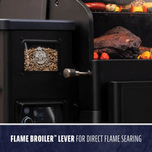 Pit Boss pellet grill with visible wood pellets, digital control, and Flame Broiler™ lever for direct flame searing.