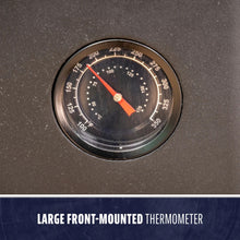 Large front-mounted thermometer with black face and red pointer.