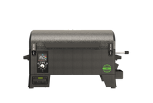 Compact black Pit Boss tabletop pellet grill with digital control panel and temperature display on the front.